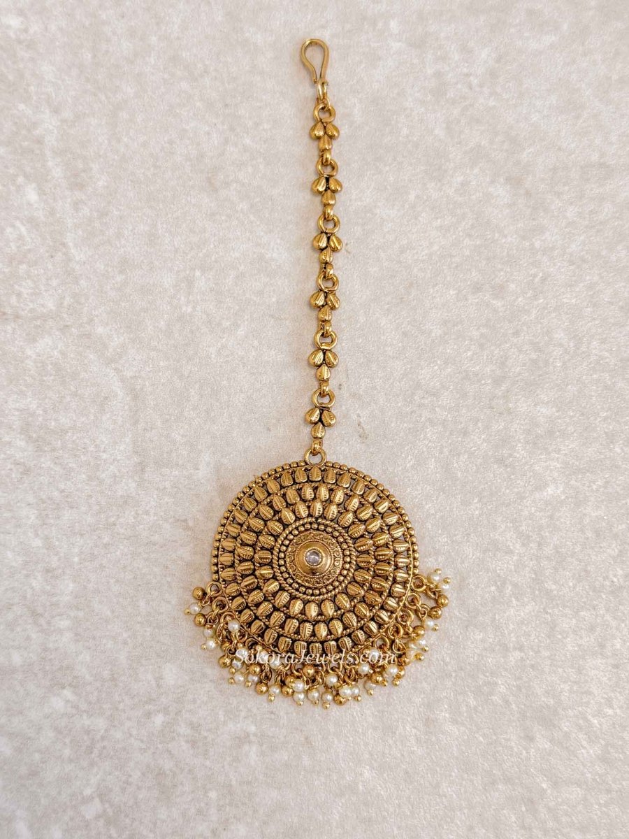 Gold Statement Maang Tikka – Pearl Drop Finish - SOKORA JEWELSGold Statement Maang Tikka – Pearl Drop Finish