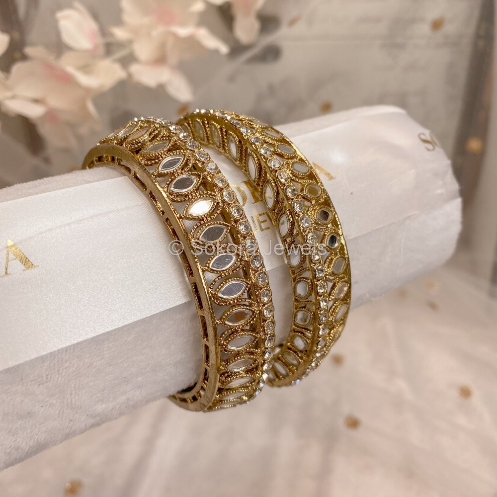 Bangles design gold hot sale latest designs tanishq